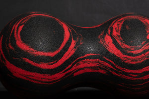 Roller-Peanut-Foam-COREFX Red and black marbled object on a white background Black and red abstract design on a textured surface