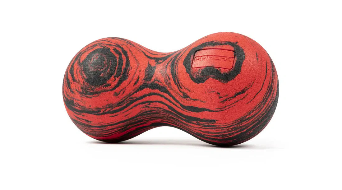 Roller-Peanut-Foam-COREFX Red and black marbled object on a white background