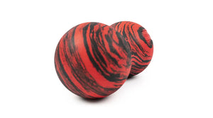 Roller-Peanut-Foam-COREFX Red and black marbled object on a white background