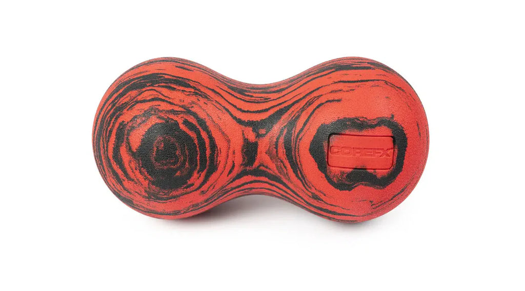 Roller-Peanut-Foam-COREFX Red and black marbled object on a white background